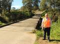 WORK: Cr John Connors at Bruxner Bridge. Dungog Council is working to replace 23 of its 24 timber bridges.