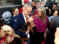Anthony Albanese, with partner Jodie Haydon, started election day in the Melbourne seat of Higgins. Picture: AAP 