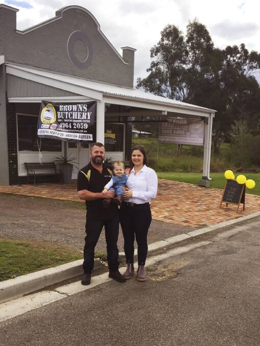 The secret to success: Tim Brown, Gabbie Caputo and their daughter Isla are excited at the fresh start in Clarence Town for Browns Butchery. Photo: Supplied