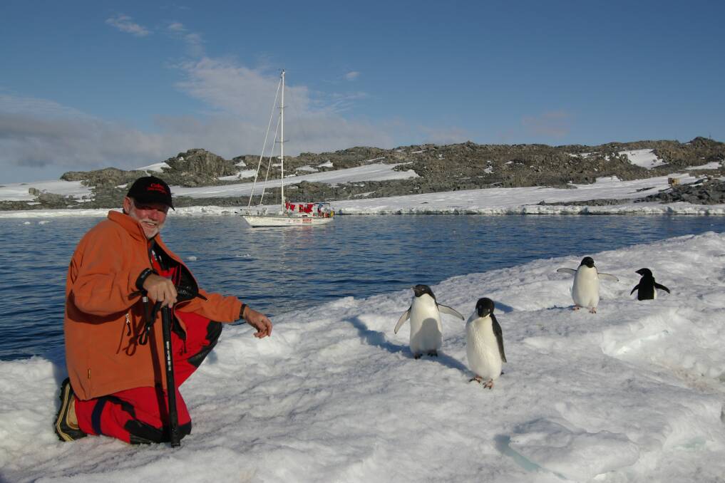 WONDERLAND: Graham Murphy with penguins. Picture: Ron Webb