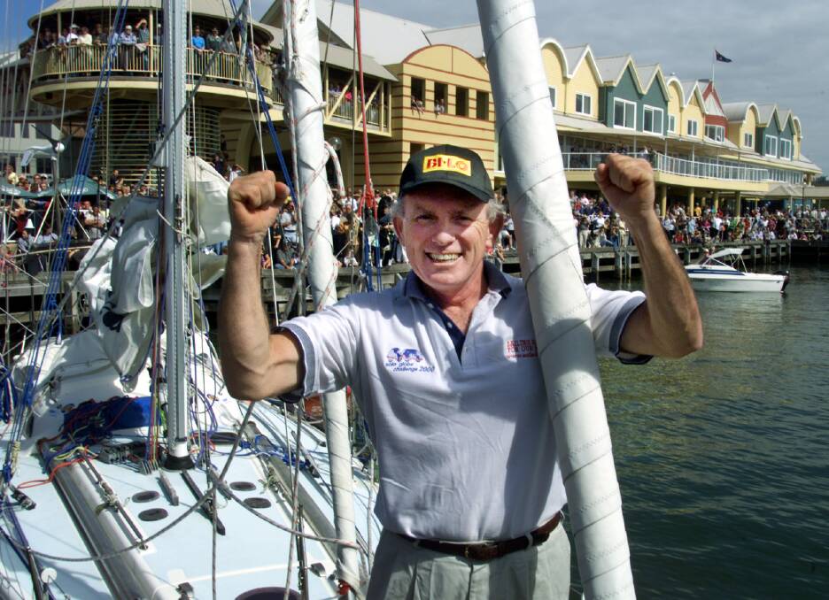 Tony Mowbray celebrates at the end of his epic solo around-the-world voyage in 2001. Picture: Ron Bell 