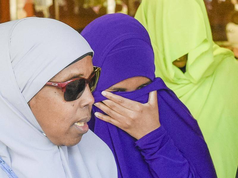 A court will consider new restrictions on Zainab Abdirahman-Khalif (centre) when released from jail.