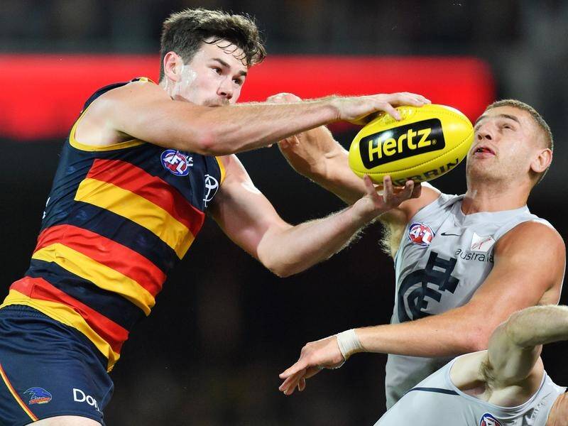 Crow Mitch McGovern, seen contesting possession with Carlton here, wants to go to the Blues.