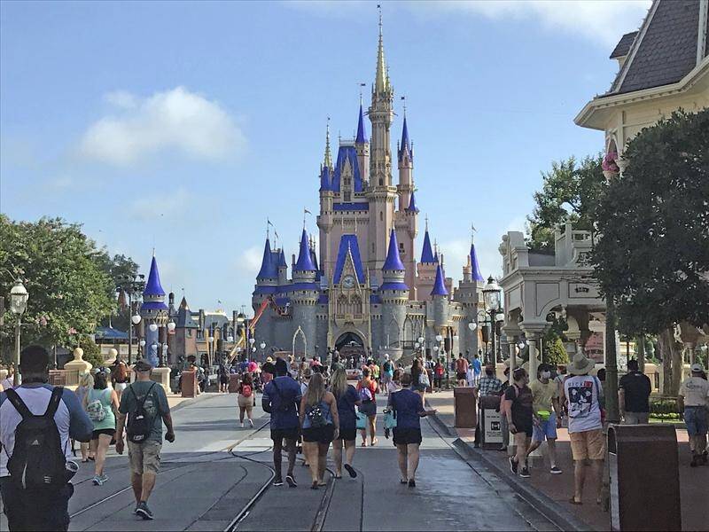 Walt Disney World is reopening in Florida amid a spike in local cases.