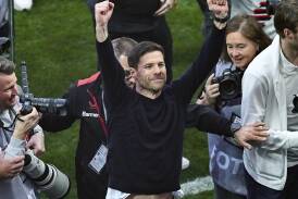Leverkusen's brilliant coach Xabi Alonso hails their incredible unbeaten Bundesliga triumph. (AP PHOTO)