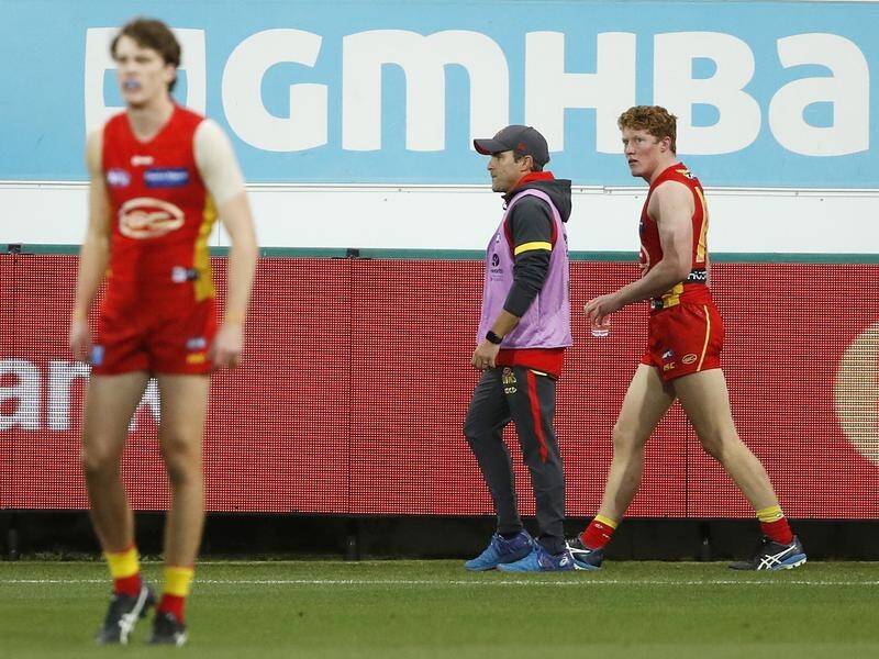 Gold Coast young gun Matt Rowell (R) has injured his shoulder in the Suns' AFL loss to Geelong.