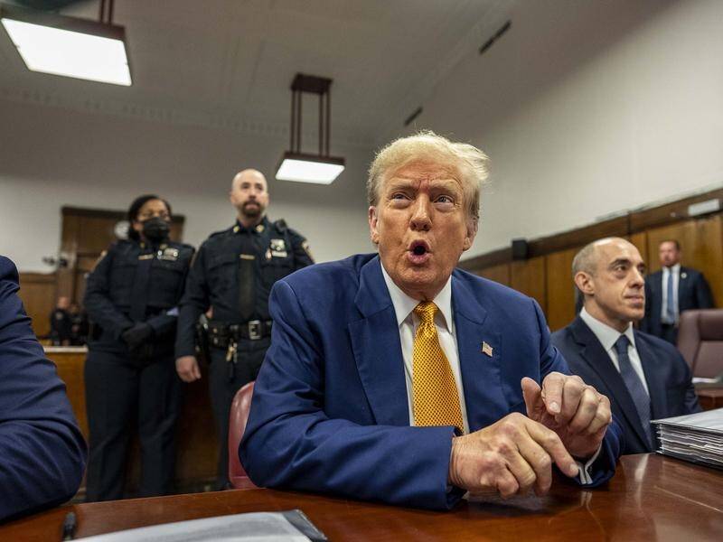 Donald Trump says prosecutors are working with Democrats to undercut his election campaign. (EPA PHOTO)