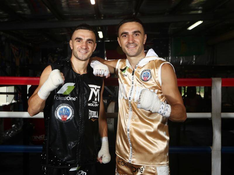 Andrew Moloney (l) wants to win the world title to ease some of the pain of brother Jason (r). (Jason O'BRIEN/AAP PHOTOS)