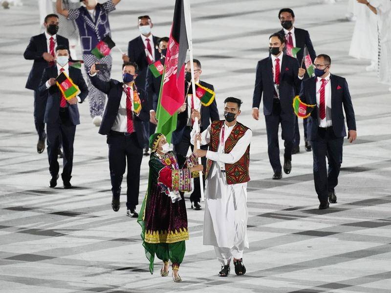 Afghanistan flag bearer Kimia Yousofi (l) is one of five Olympians to have relocated to Australia. (AP PHOTO)