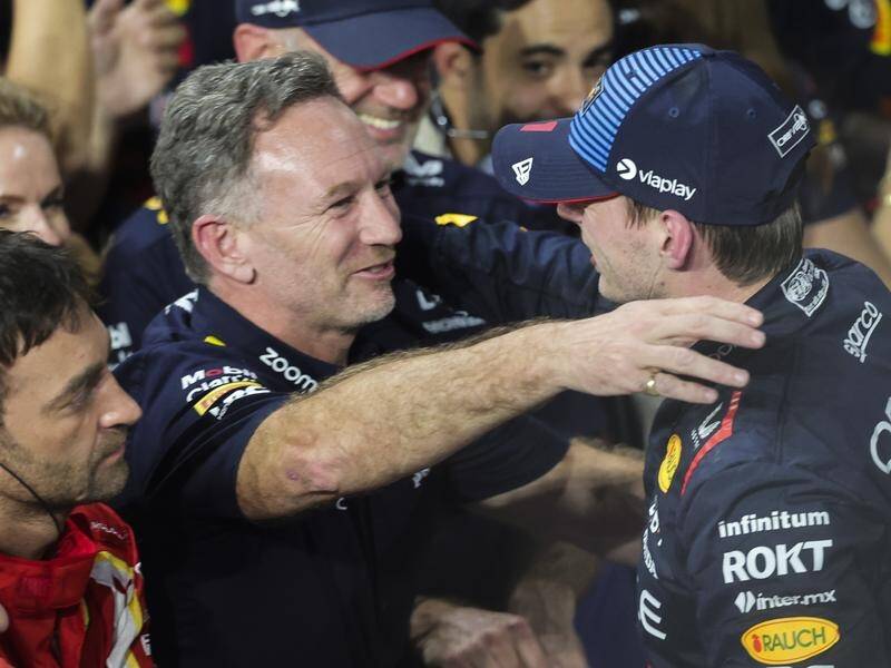 Max Verstappen (R) celebrates with team boss Christian Horner after winning the Saudi Grand Prix. (AP PHOTO)