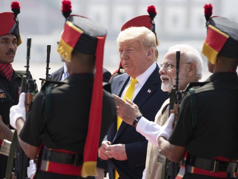 President Donald Trump is greeted by Indian Prime Minister Narendra Modi in Ahmedabad.