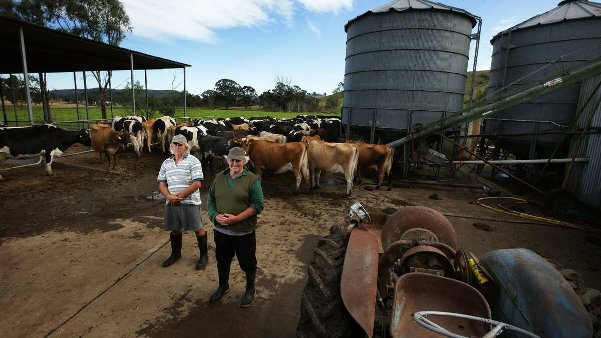 Torryburn dairy farming brothers Lew and Joe Brennan at their family dairy which  was isolated due to the missing Torryburn Bridge as a result of the April storm. The milk they produced was dumped in their paddocks until  milk trucks were able to access their property via an newly constructed road through neighbouring properties. Picture: Peter Stoop
