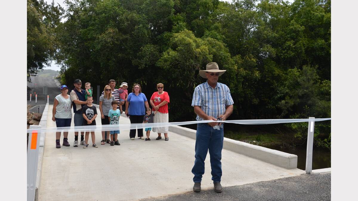 David Gorton snr cutting the ribbon to open the new bridge