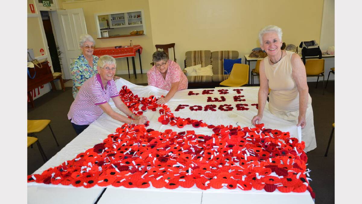 Working on the final stages of the poppy display are, clockwise from left, Judy Kennedy, Lorna Johnson, Lorraine Walker and Ruth Leslie.
