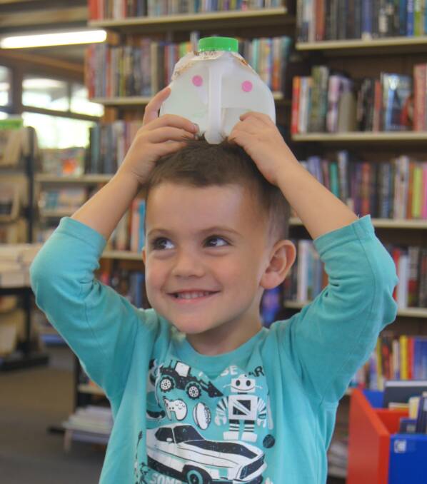 Elijah Liebregts, 3, enjoys a story and craft at Dungog Library.
