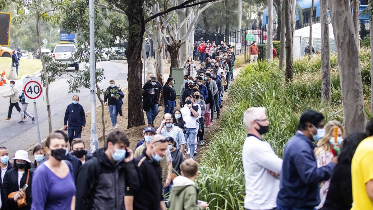 Long queues of people at the NSW Vaccination Centre in Homebush, Sydney, on Thursday. Picture: Getty Images