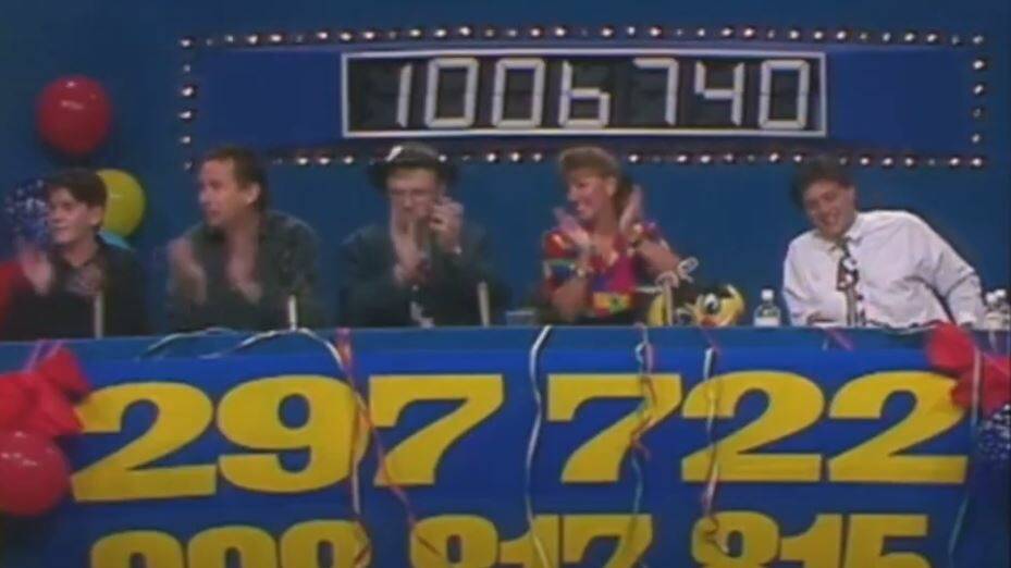 James Joyce, then a reporter at the Newcastle Herald, sits next to Romper Room's Miss Kim and Mr Do-Bee on the judging panel for the overnight talent quest on Newcastle TV station NBN's 1993 telethon. Picture by NBN Television 