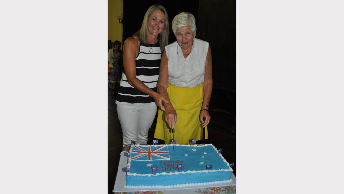  Debbie Watson OAM with Dungog Shire’s Citizen of the Year Margot Capp cutting the Australia Day cake.